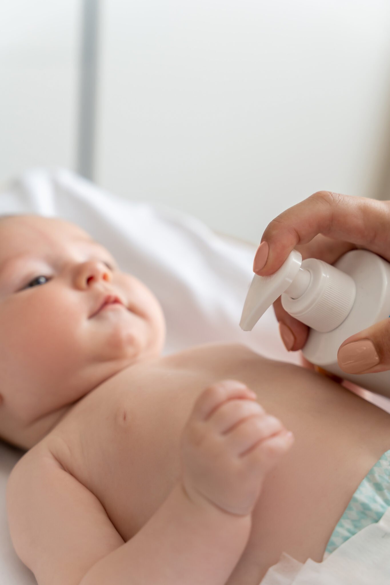 Elementor Page #1822 mother using cream for taking care of newborn baby body